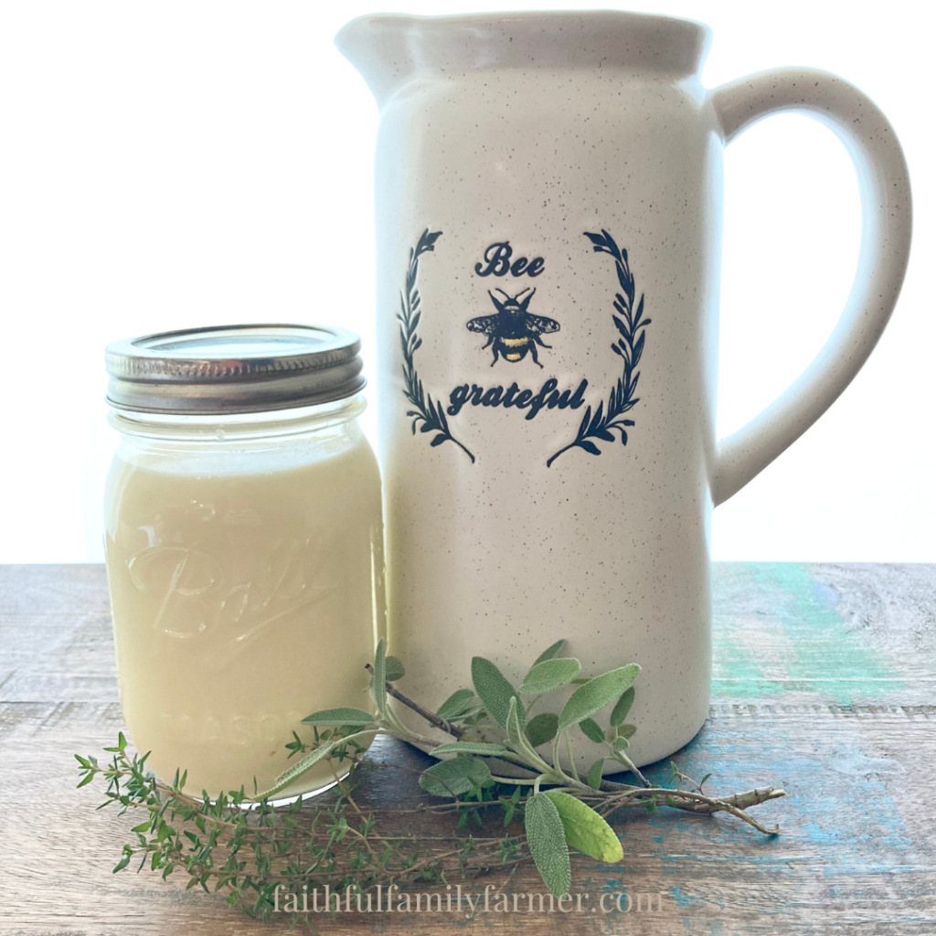 Raw milk on a wood table next to  a modern vase