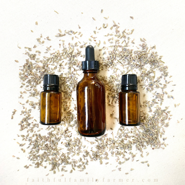 3 amber glass jars in a row with herbs