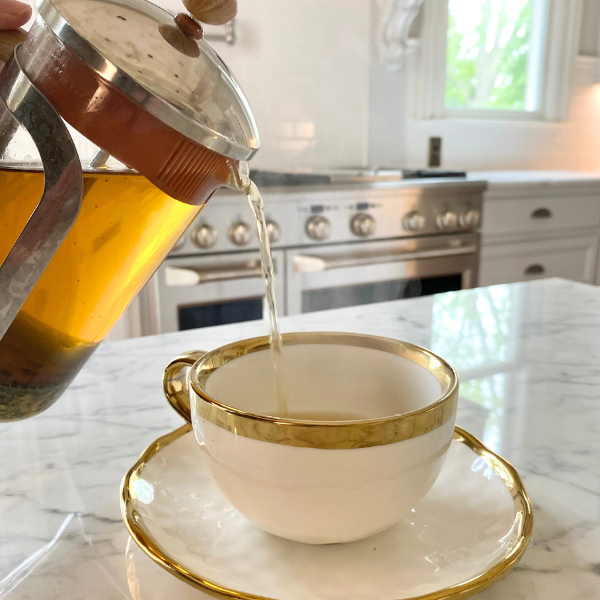 herbal tea being poured 